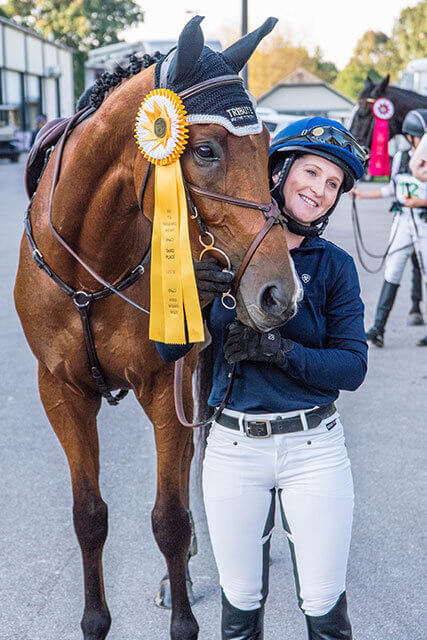 Rosie Napravnik posing with her horse. Picture used by MagnaWavePEMF