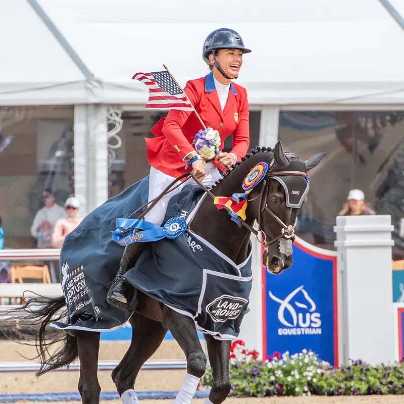 Rider celebrating a win with their horse